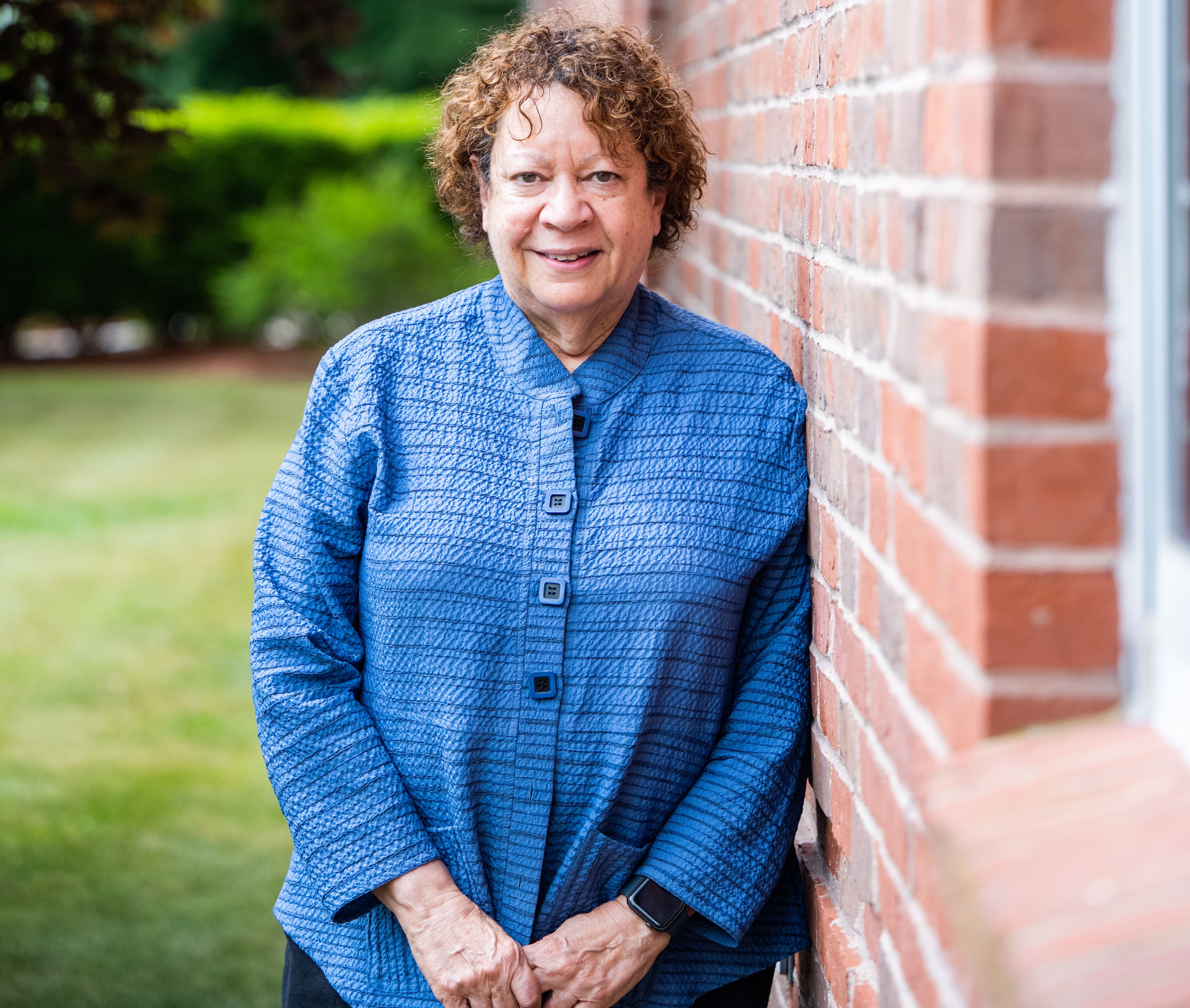 DR. CAROL BONNER, Associate Dean of the School of Social Work, meets with Master of Social Work students outside her office.